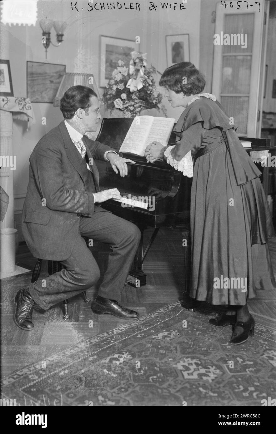 K. Schindler & wife, Photograph shows German composer and conductor Kurt Schindler at a piano with his wife, actress wife Russian actress Vera Androuchevitch (d. 1919)., 1916 Nov. 28, Glass negatives, 1 negative: glass Stock Photo