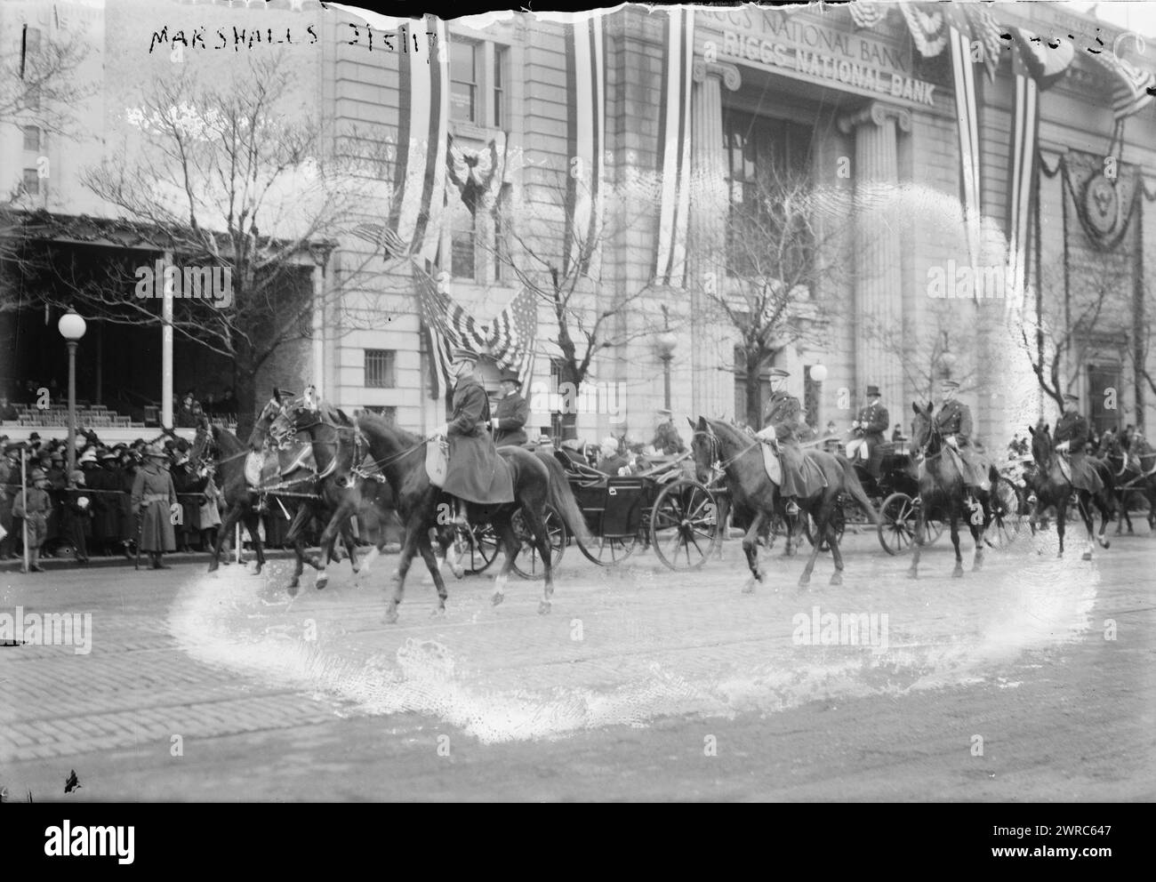 Marshalls, Photograph shows Vice President Thomas Riley Marshall in a carriage, passing the Riggs National Bank building on Pennsylvania Avenue during the parade for President Woodrow Wilson's second inauguration., 1917 March 5, Glass negatives, 1 negative: glass Stock Photo