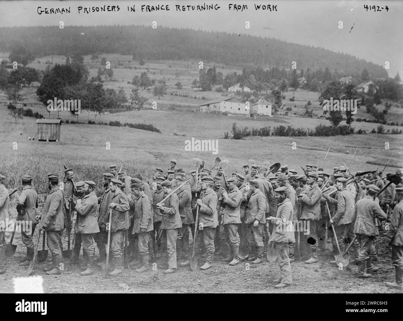German prisoners in France returning from work, Photograph shows German prisoners with spades in a field in France during World War I., 1917, World War, 1914-1918, Glass negatives, 1 negative: glass Stock Photo