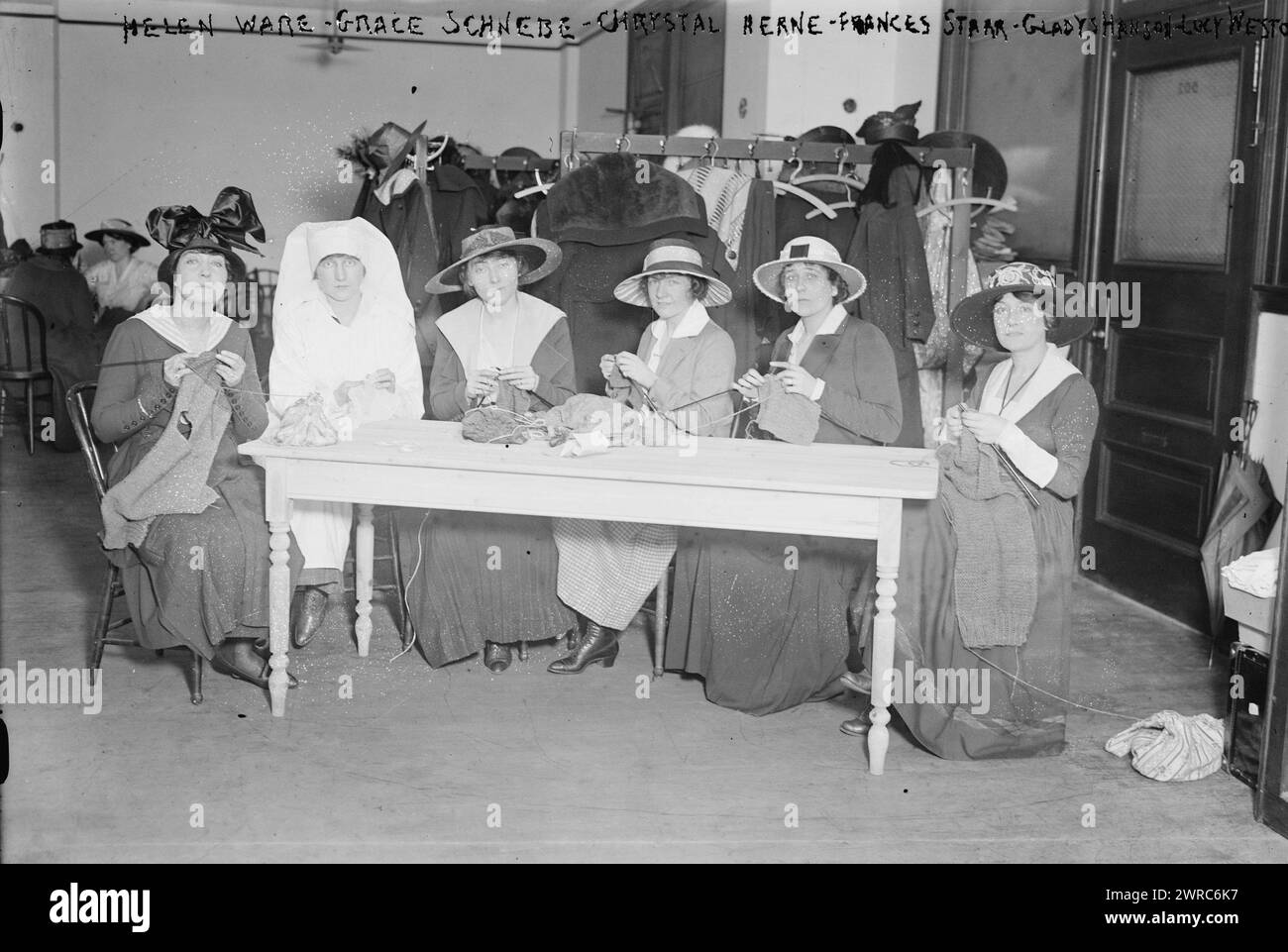 Helen Ware, Grace Schnebe i.e. Schnebbe, Chrystal Herne, Frances Starr, Gladys Hanson, Lucy Weston, Photograph shows actresses Helen (Remer) Ware (1877-1939), Grace Schnebbe (Mrs. Howard Schnebbe), Lucy Weston and others knitting for soldiers during World War I as part of the Stage Women's War Relief project in New York City., 1917 May, Glass negatives, 1 negative: glass Stock Photo