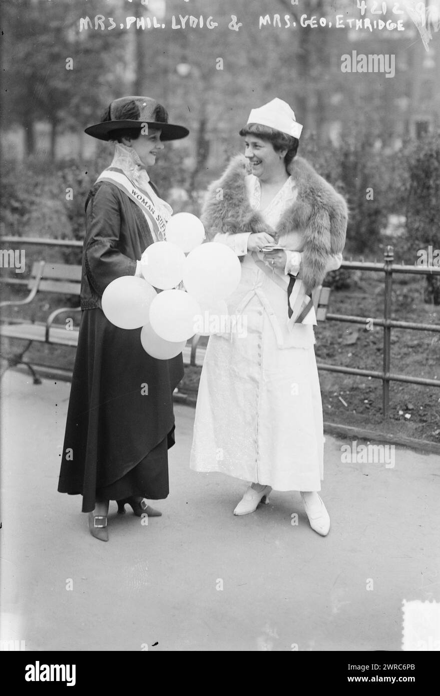 Mrs. Phil. Lydig & Mrs. Geo. Ethridge, Photograph shows Mrs. Philip Lydig (Rita Hernandez de Alba de Acosta) (1857-1929) wearing a woman suffrage sash, speaking with Mrs. George Etheridge (Julia Dinsmore Flandrau)., 1817 May 13, Glass negatives, 1 negative: glass Stock Photo