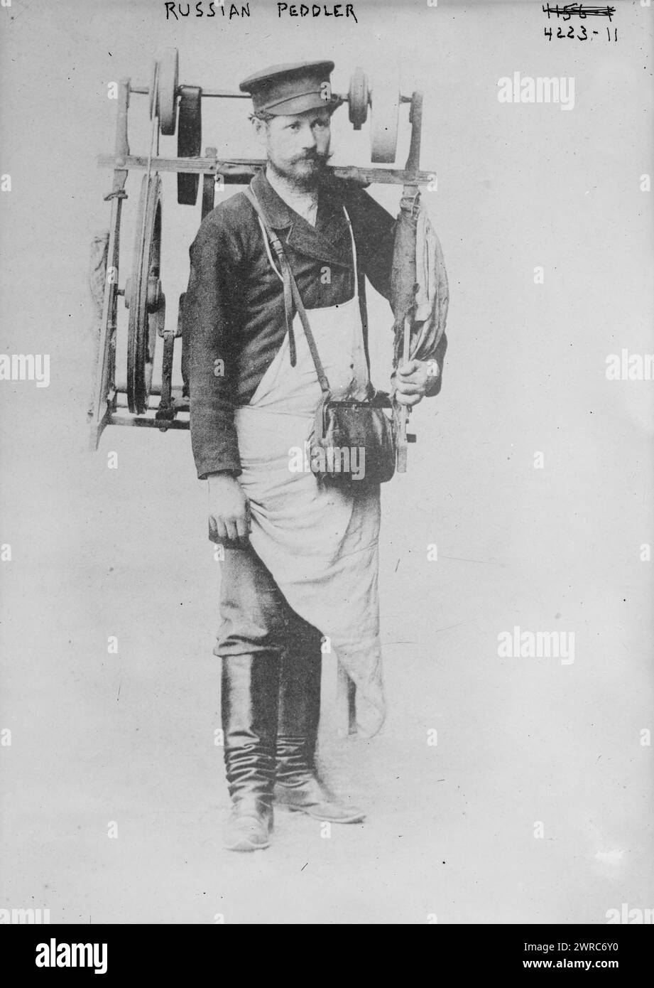 Russian Peddler, Photograph shows an itinerant, door-to-door knife grinder., between ca. 1915 and ca. 1920, Glass negatives, 1 negative: glass Stock Photo