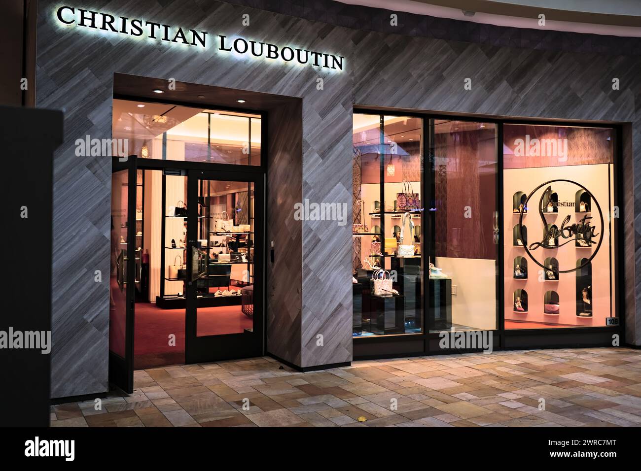 Honolulu, HI - January 9, 2024: Christian Louboutin designer label mall boutique exterior Stock Photo