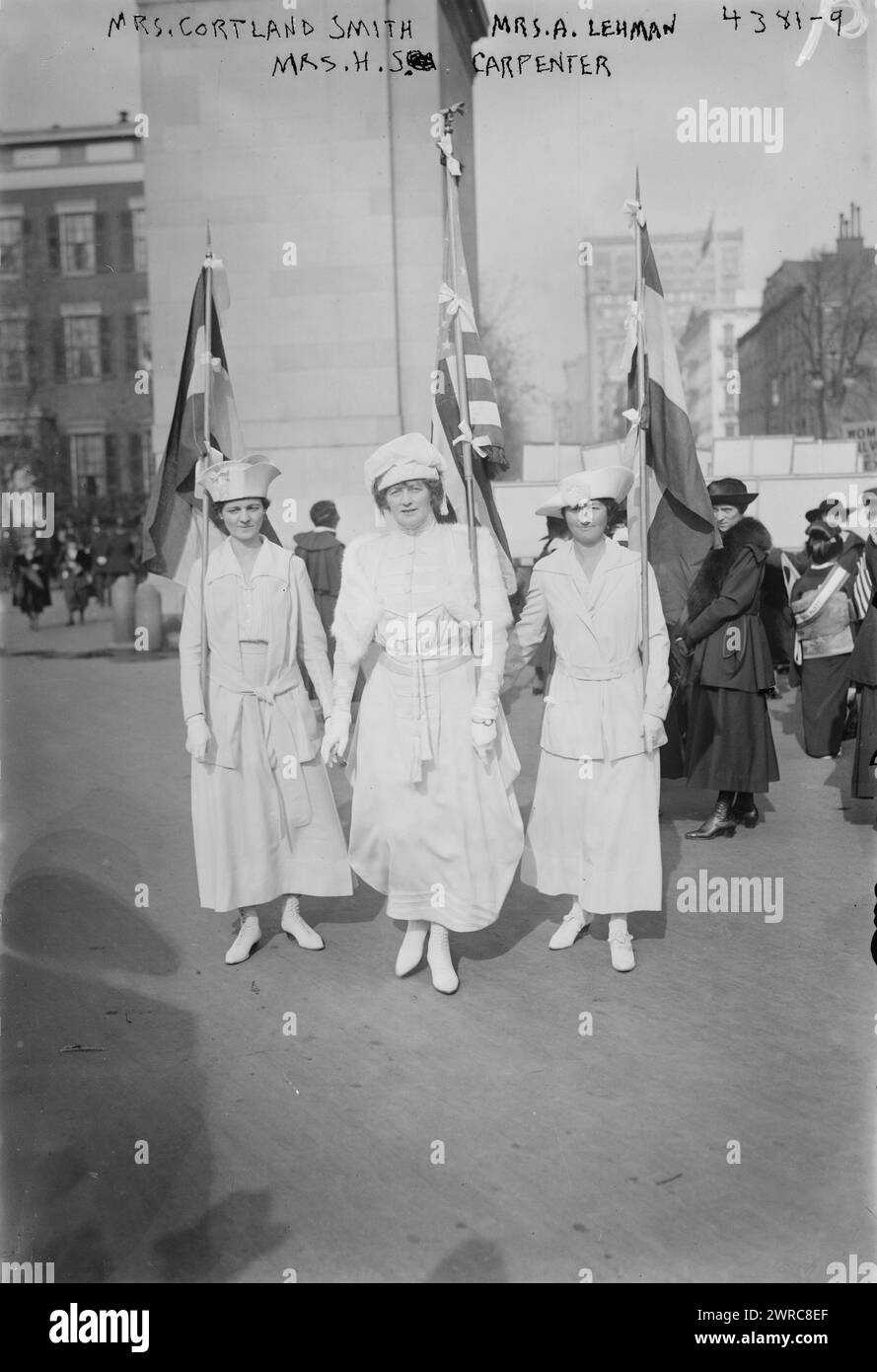 Mrs. Cortland Smith, Mrs. A. Lehman, Mrs. H.S. Carpenter, Photo shows Mrs. Cortland Smith, Mrs. A. Lehman, and Mrs. Herbert S. Carpenter carrying flags in suffrage parade, New York City, Oct. 27, 1917., 1917 Oct. 27, Glass negatives, 1 negative: glass Stock Photo