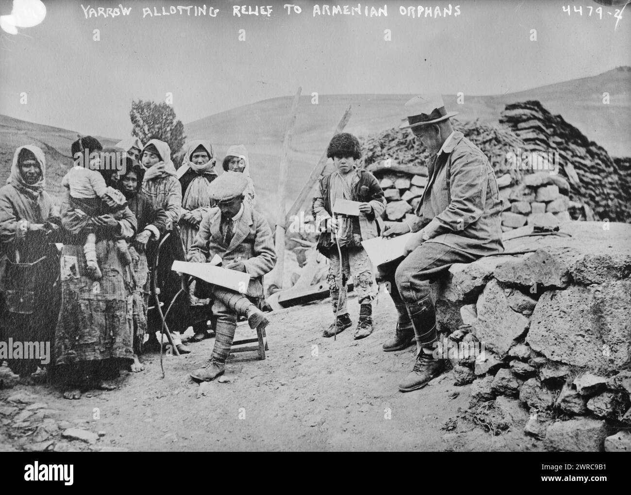 Yarrow allotting relief to Armenian orphans, Photograph shows missionary Ernest Alfred Yarrow (1876-1939), who served as head of the Near East Relief in Armenia with Armenian women and children., between ca. 1915 and ca. 1920, Glass negatives, 1 negative: glass Stock Photo