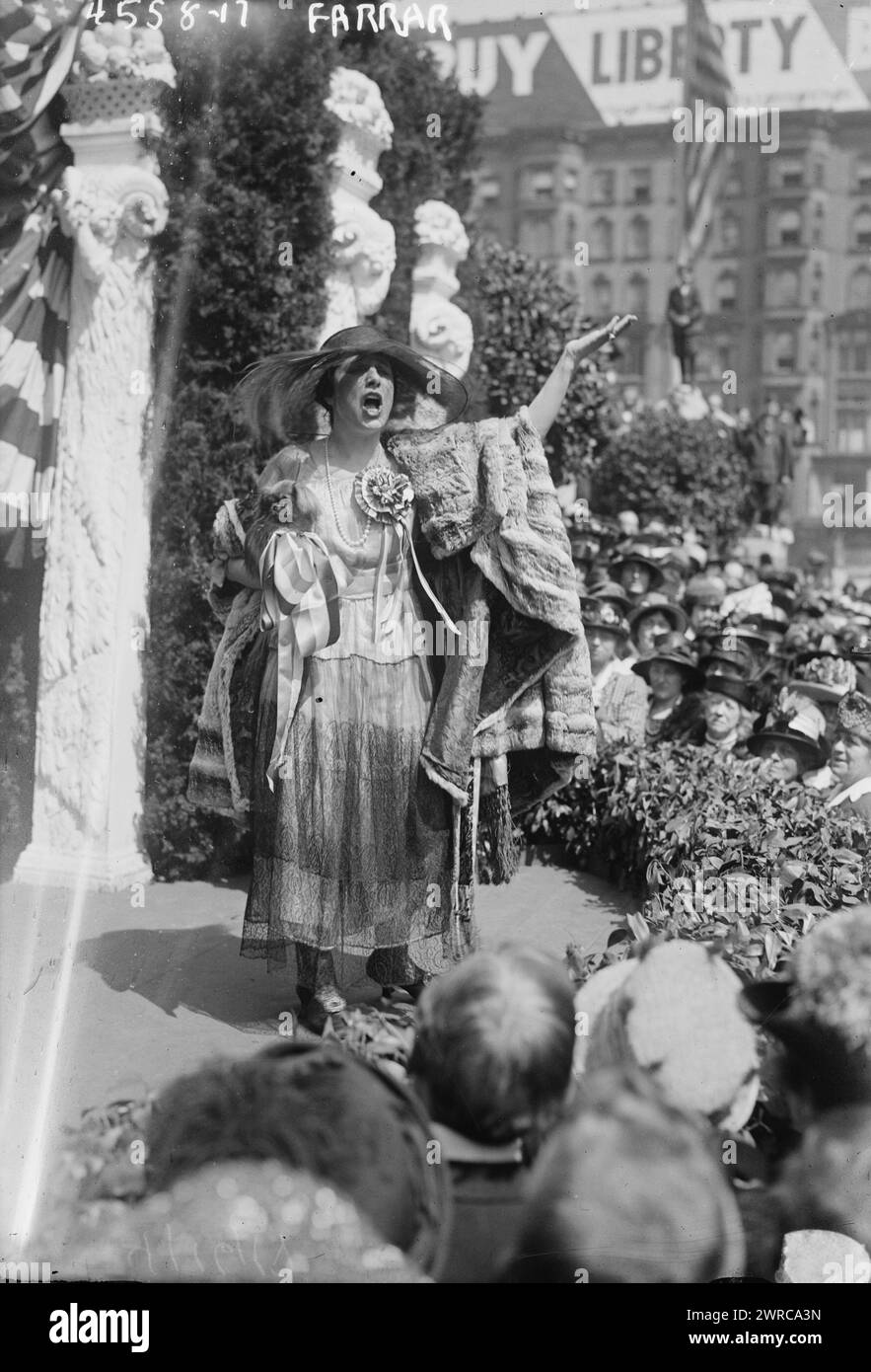 Farrar, Photograph shows a concert by soprano opera singer Geraldine Farrar (1882-1967) which was part of the Women's War Relief Association's Liberty Theater in front of the New York Public Library at 5th Avenue and 42nd Street in New York City. Performances and speeches were held to appeal to the public to buy Liberty bonds. The theater was part of the Third Liberty Loan drive, which was held from April 6, 1918 to May 4, 1918 during World War I. Farrar's Pekinese dog Sniffles is with her., 1918 April 15, World War, 1914-1918, Glass negatives Stock Photo