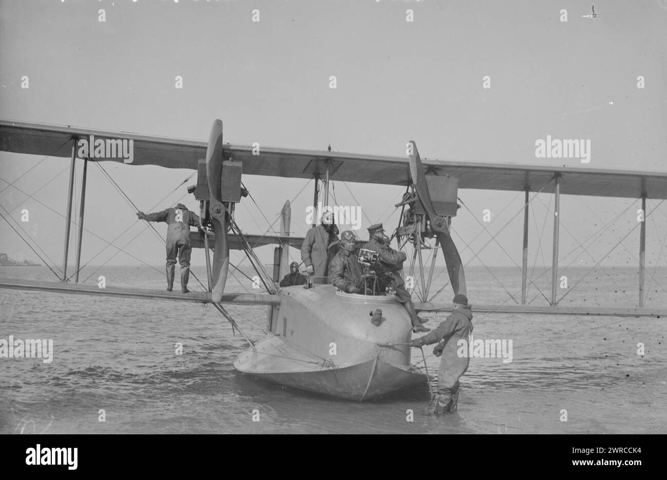 At Rockaway from Hampton Roads, Photograph shows a F5L Flying Boat after landing from a trip from Hampton Roads, Virginia to Rockaway Naval Air Station, Queens, New York City. A movie camera is mounted in the forward gunner'sposition., between ca. 1915 and ca. 1920, Glass negatives, 1 negative: glass Stock Photo