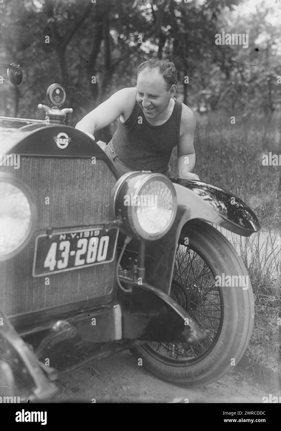 Fields, Photograph shows Arthur Fields (1884-1953) who was a singer and songwriter, with a Stutz automobile., between ca. 1915 and ca. 1920, Glass negatives, 1 negative: glass Stock Photo