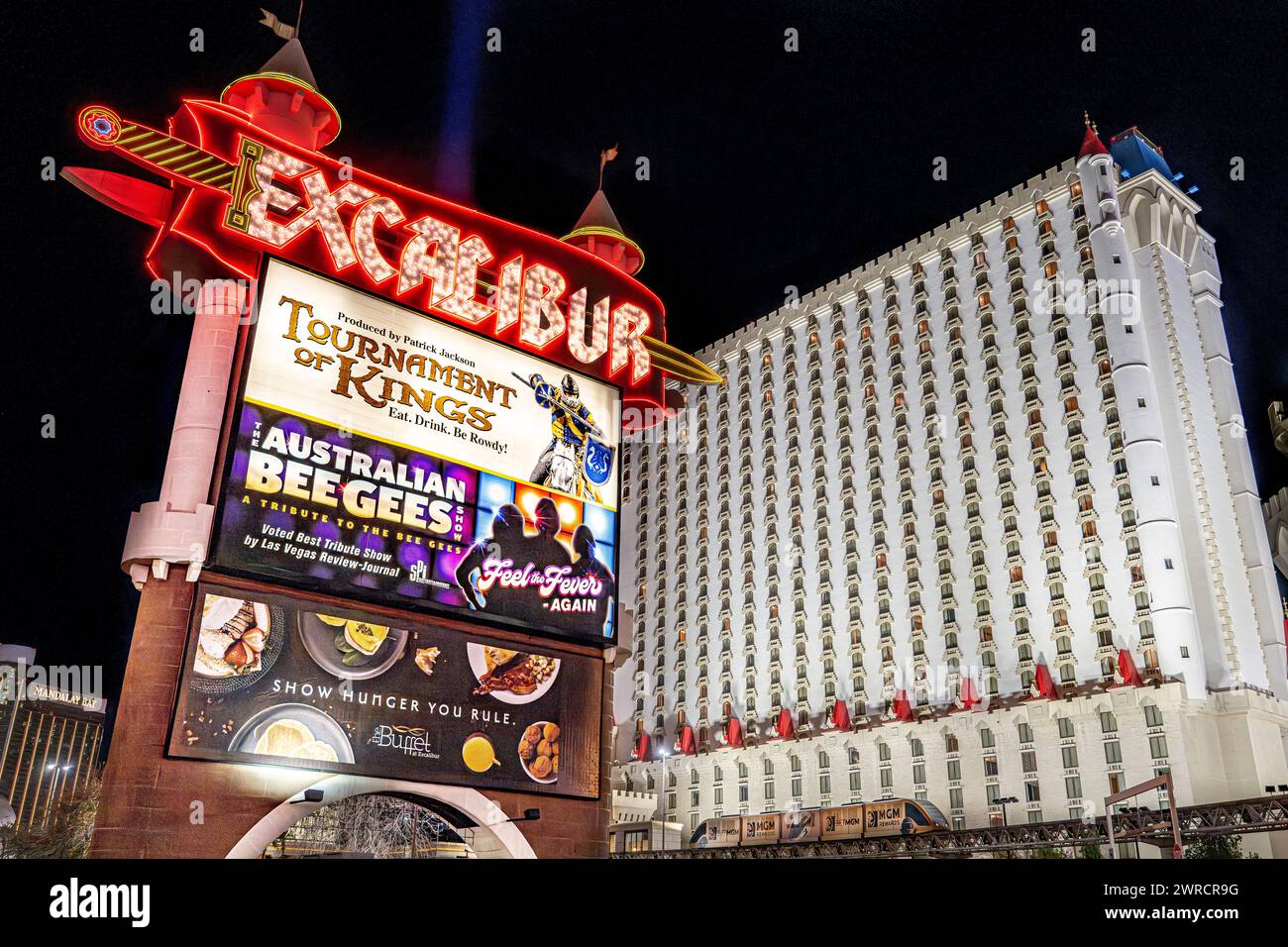 Las Vegas Boulevard strip Excalibur casino at night 2024 - Nevada city lights colorful signs and tourist attractions near popular casinos gambling USA Stock Photo