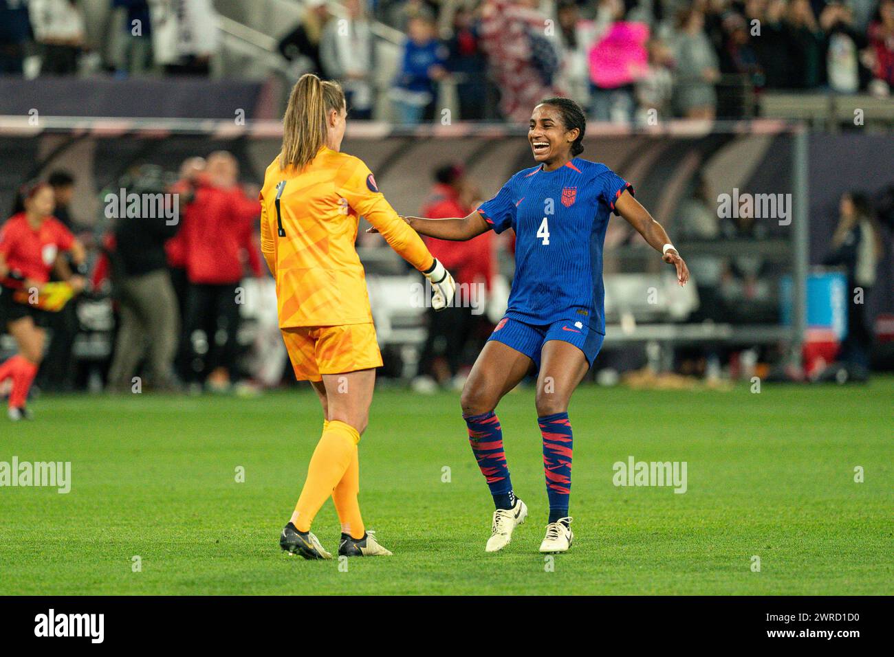 United States defender Naomi Girma (4) celebrates with goalkeeper Alyssa Naeher (1) after winning the Concacaf W Gold Cup final match against Brazil, Stock Photo