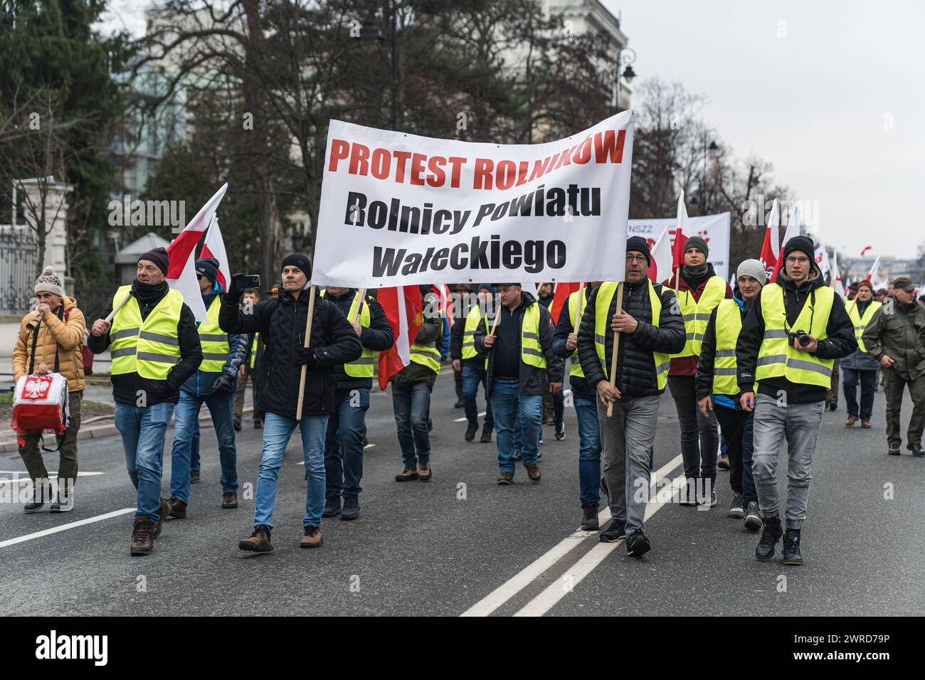 06.03.2024. Warsaw, Poland. polish men carrying a banner saying protest rolnikow rolnicy powiatu waleckiego, demonstration. High quality photo Stock Photo