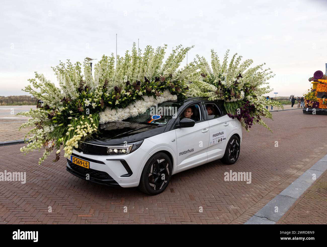 Noordwijk, Netherlands - April 22, 2023: Cars decorated with flowers taking part in the Bloemencorso Bollenstreek the annual spring flower parade from Stock Photo