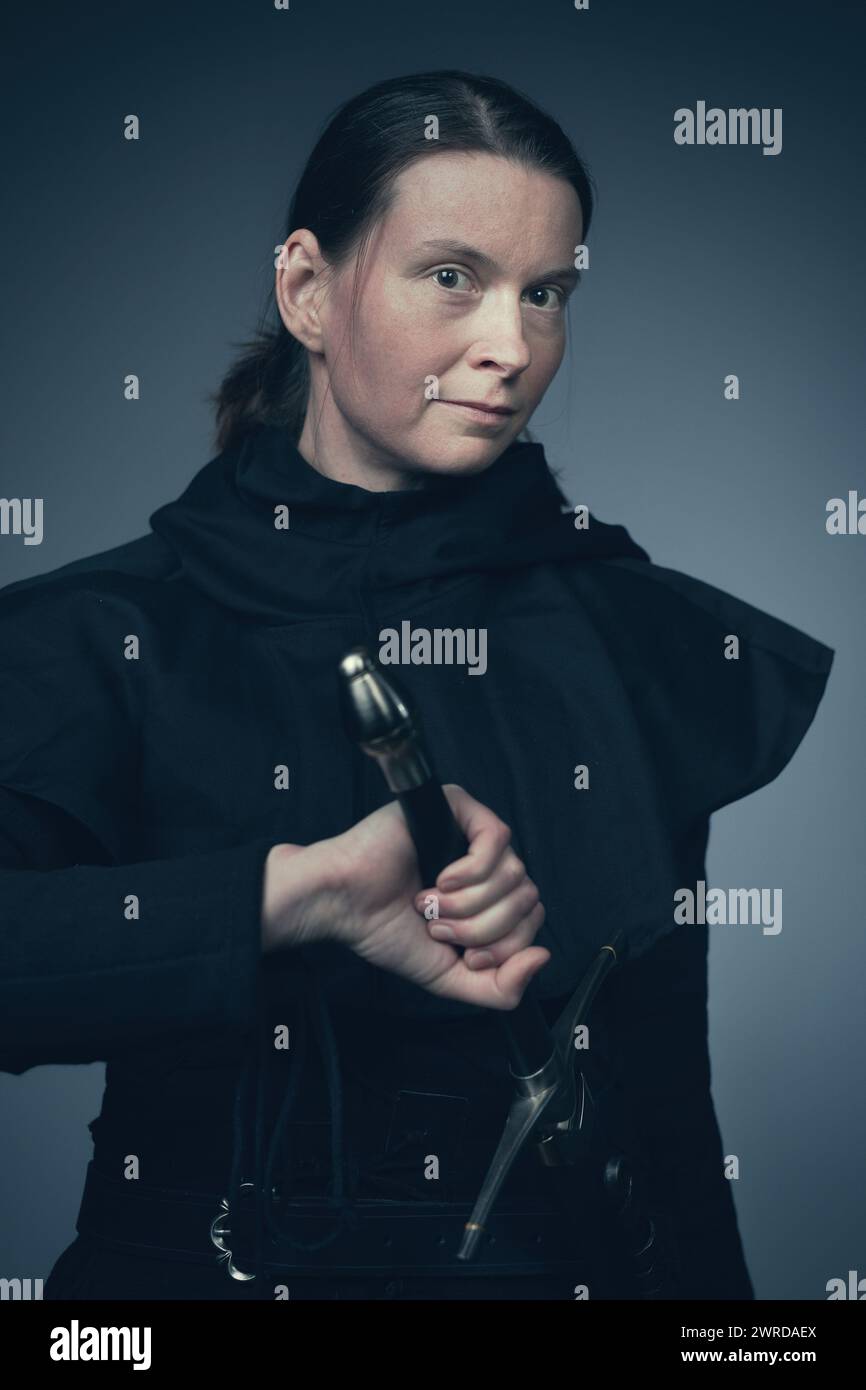 Medieval infantry armed woman dressed in classic gambeson Stock Photo