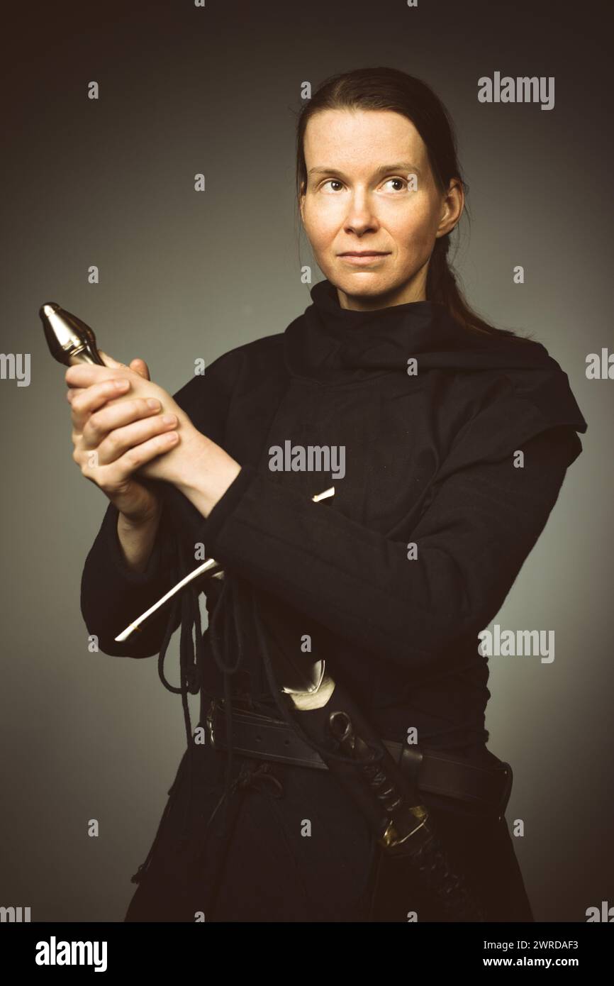 Medieval infantry armed woman dressed in classic gambeson Stock Photo