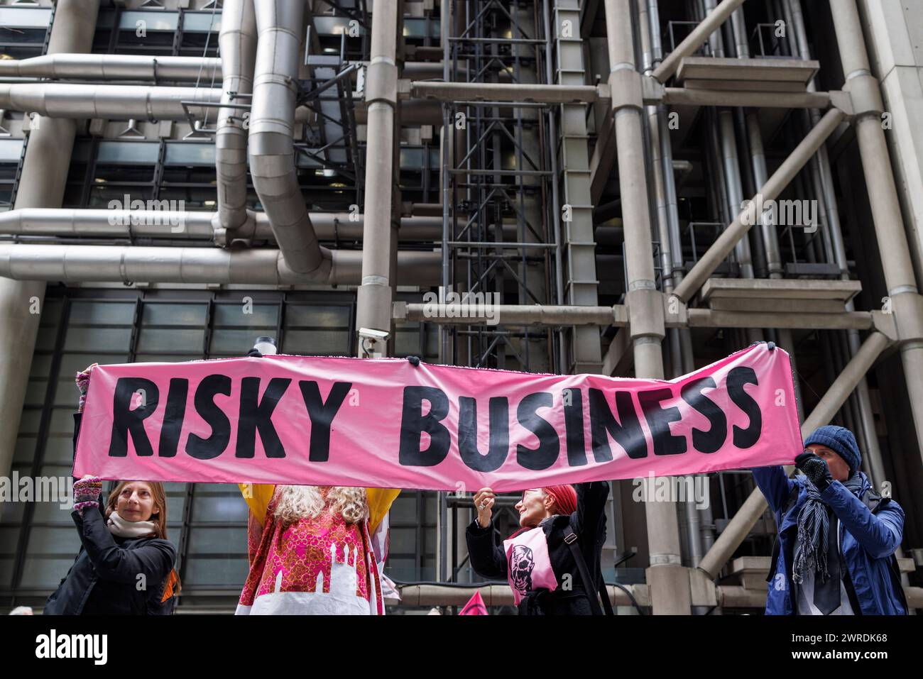 28th Feb. 2024. Lloyds of London Insurance Building, City of London‘.  Insure Our Future’ protestors surround Lloyds of London demanding they take immediate action to slow the climate crisis and support the urgent transition from dangerous fossil fuels to clean energy. The occupation is part of a global week of action organised by the Insure Our Future network, running from 26th Feb – 3rd March. Grassroots groups and activists from across the world are coming together to demand action, with events taking place in the UK, USA, Japan, South Korea, Uganda, DRC, Switzerland, France, Peru, Colombia Stock Photo