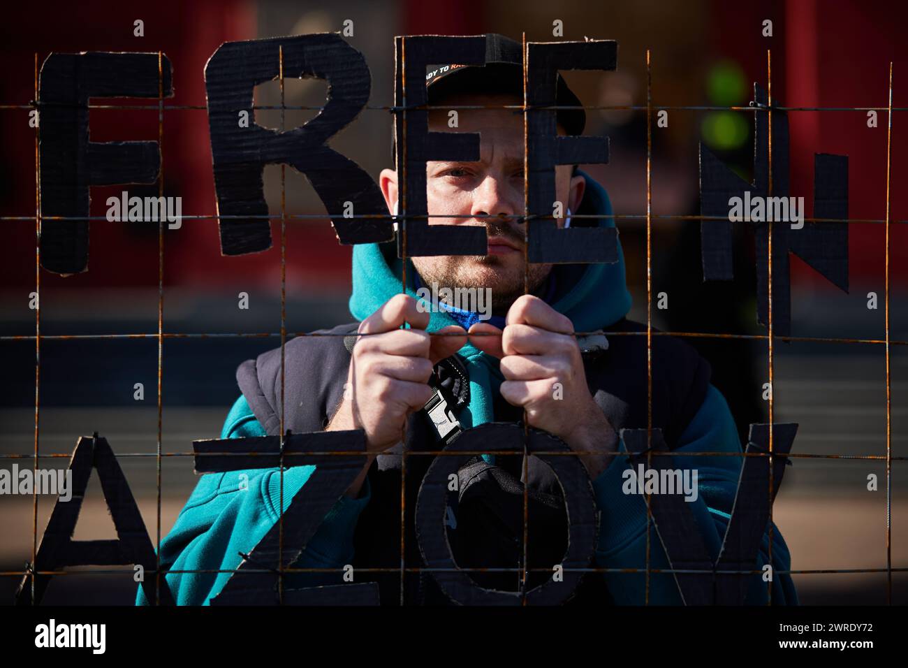 Ukrainian activist posing with a sign 