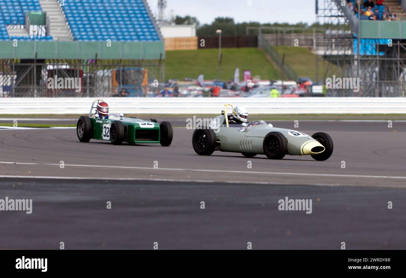 Andrew Hibberd, in his Green, 1960, Lola Mk2, leading Ray Mallock, in his Green, 1960, U2 Mk2, into the Loop during the Historic Formula Junior Race Stock Photo