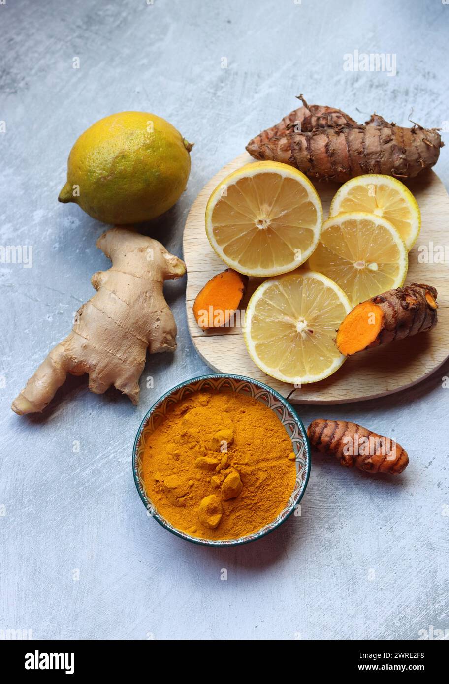 Still life with ginger, turmeric and lemon. Healthy food close up. Cold and flu season concept. Stock Photo