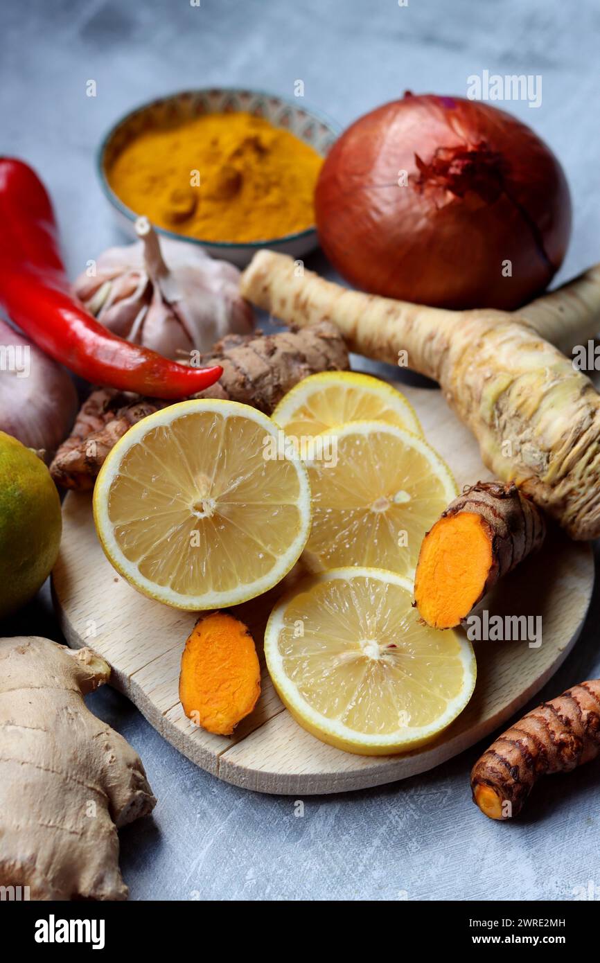 Still life with ginger, turmeric and lemon. Healthy food close up. Cold and flu season concept