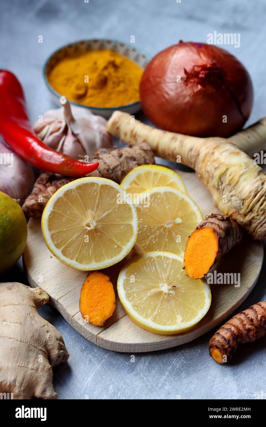 Still life with ginger, turmeric and lemon. Healthy food close up. Cold and flu season concept. Stock Photo