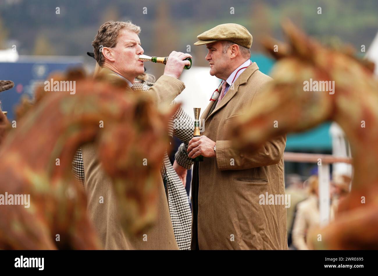 Racegoers drinking champagne on day one of the 2024 Cheltenham Festival ...