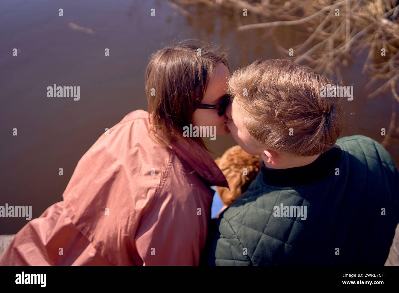 Young couple kissing on pier hi-res stock photography and images - Alamy