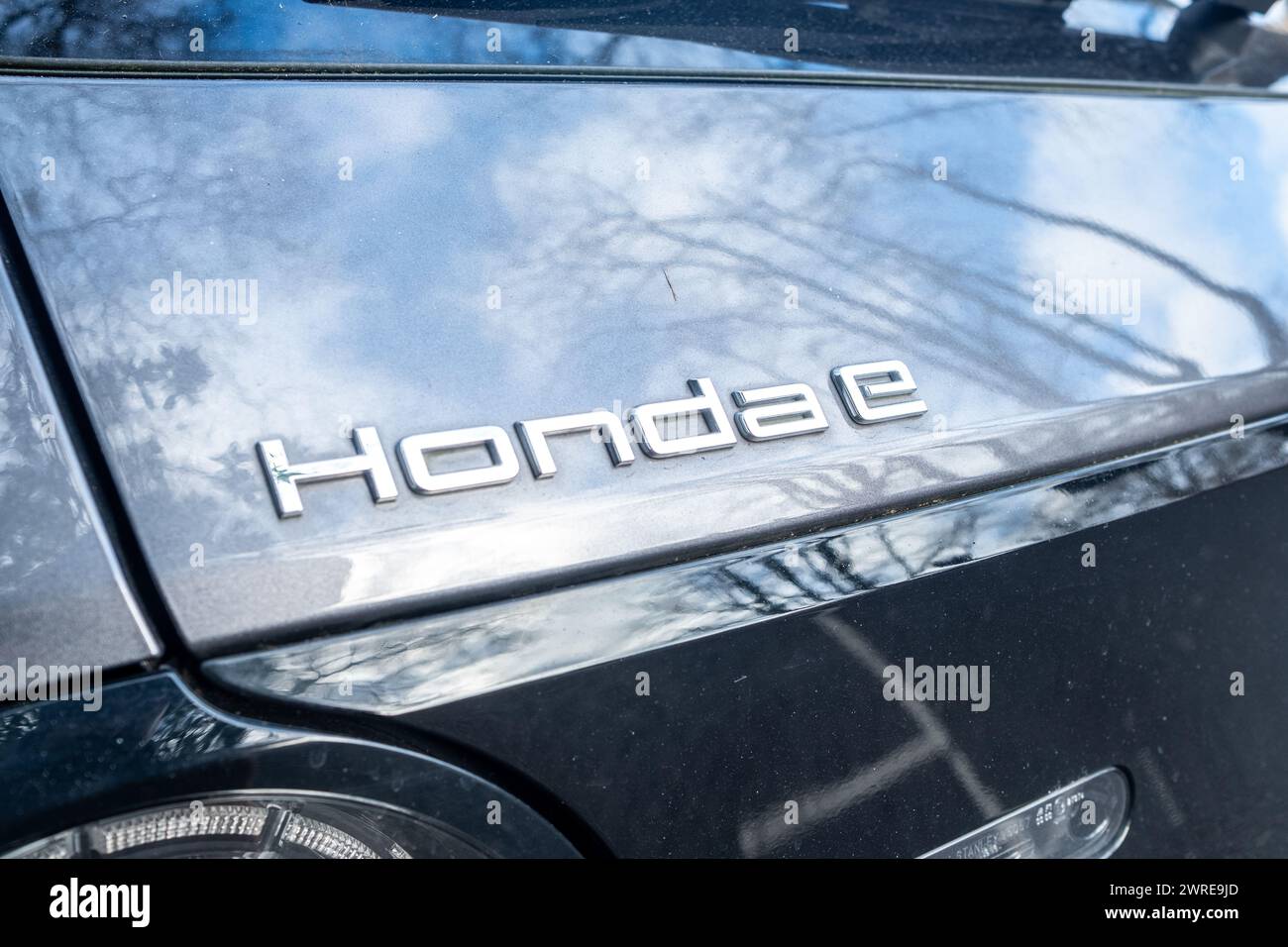 LONDON- JANUARY 11 , 2024: Honda E electric car charging on roadside in South Kensington Stock Photo