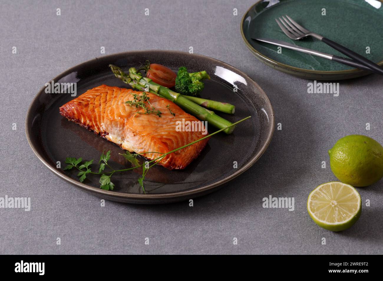 Pan-seared salmon steaks are a delicious and healthy dish. The salmon is cooked to perfection, so the skin is crispy and the flesh is moist. Stock Photo