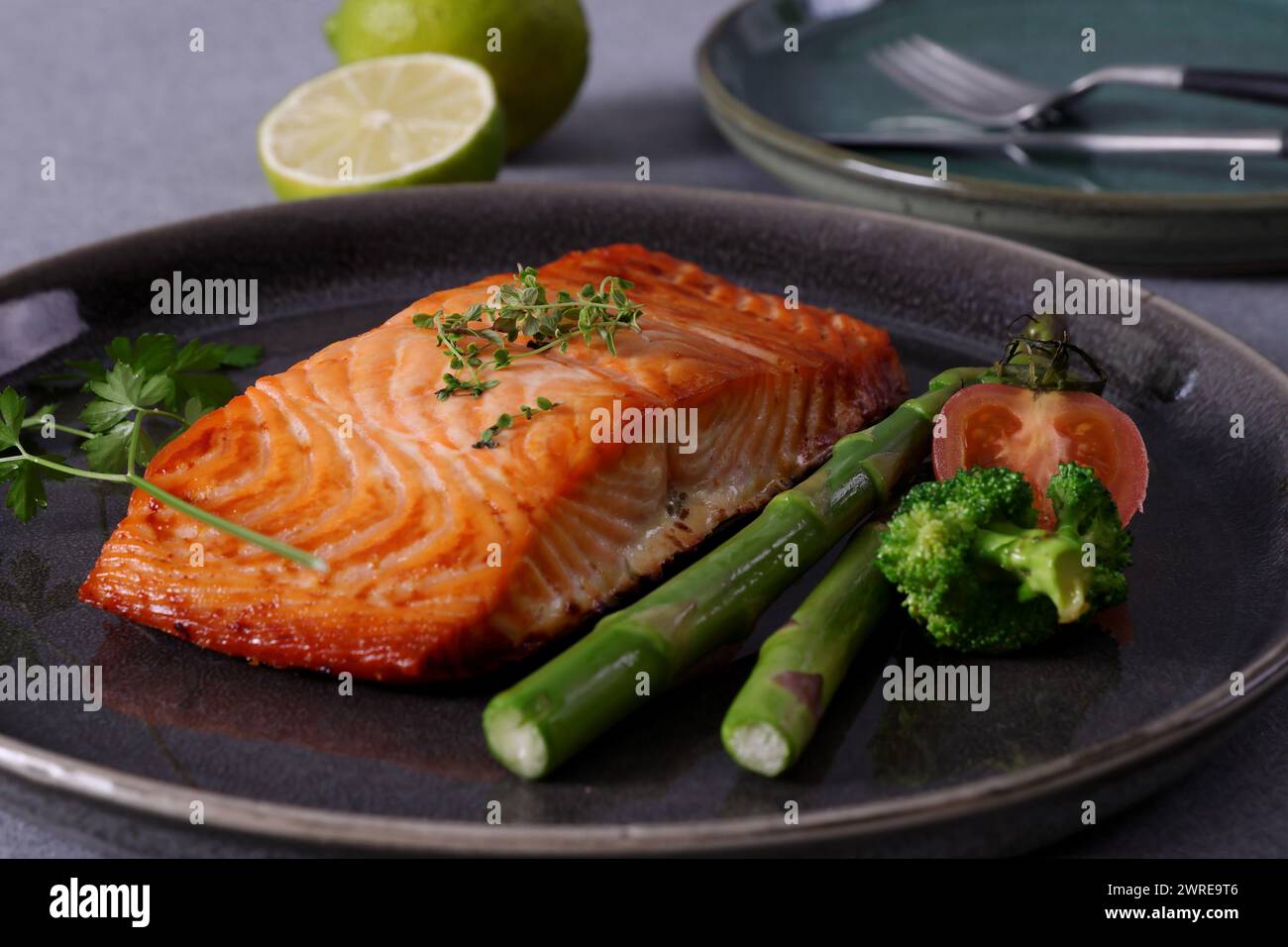 Pan-seared salmon steaks are a delicious and healthy dish. The salmon is cooked to perfection, so the skin is crispy and the flesh is moist. Stock Photo