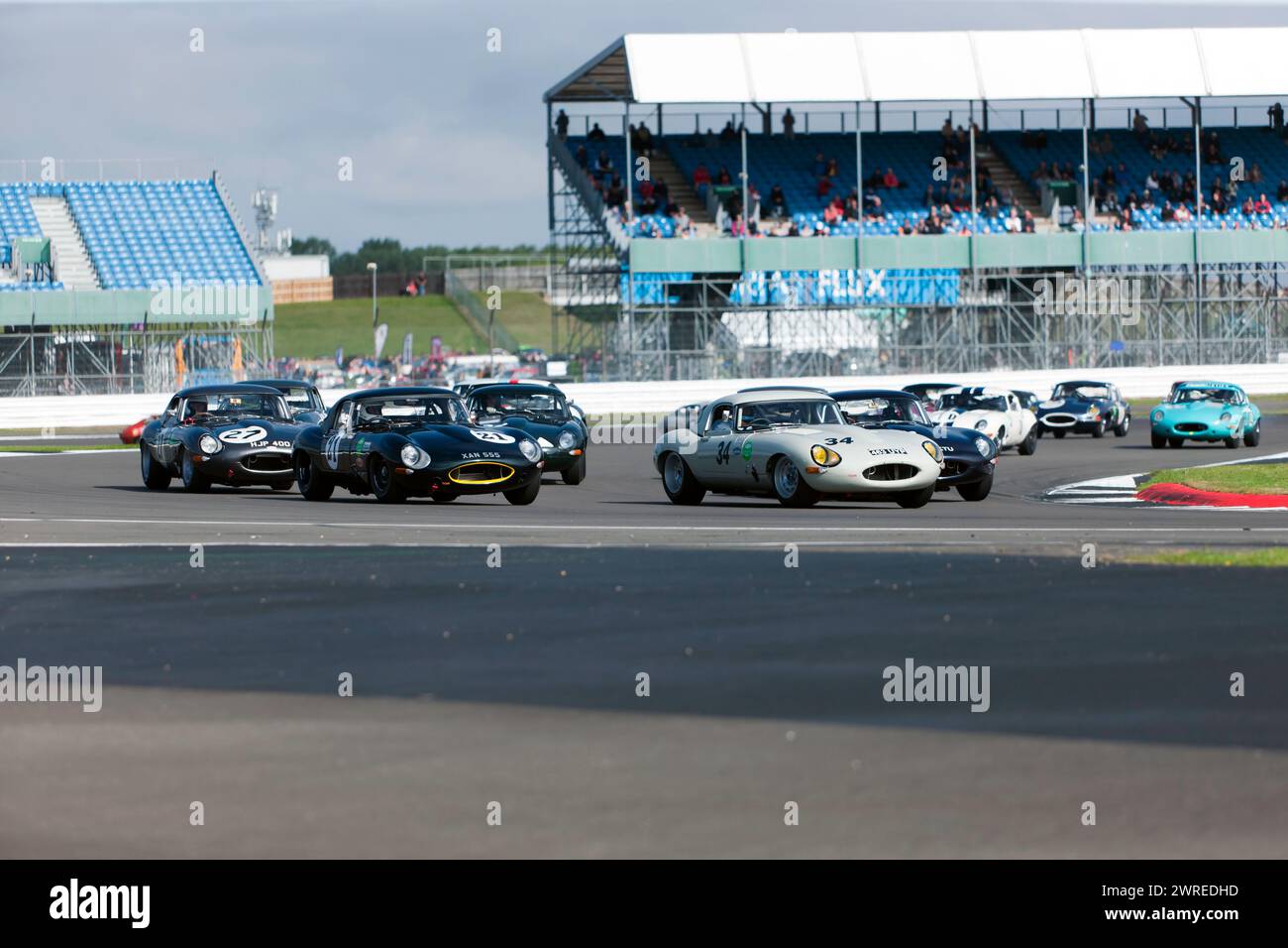 James Thorpe and Graeme Dodd, leading the Big Cat Challenge, shortly after the Rolling Start, at the 2023 Silverstone Festival Stock Photo