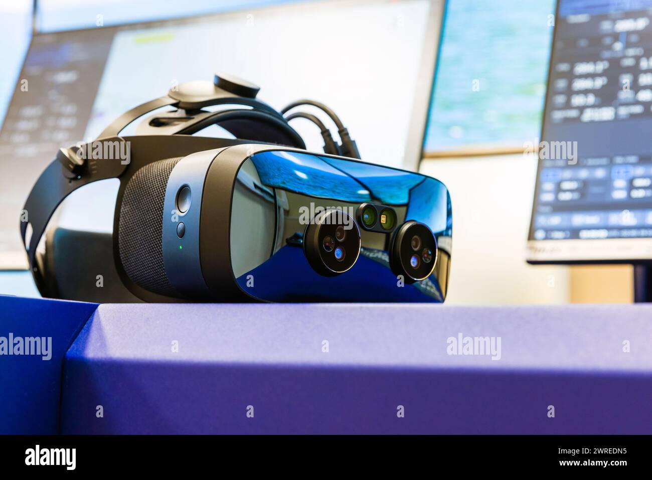 VR headset with cameras of the augmented reality lays on the desk, close up photo with selective focus Stock Photo