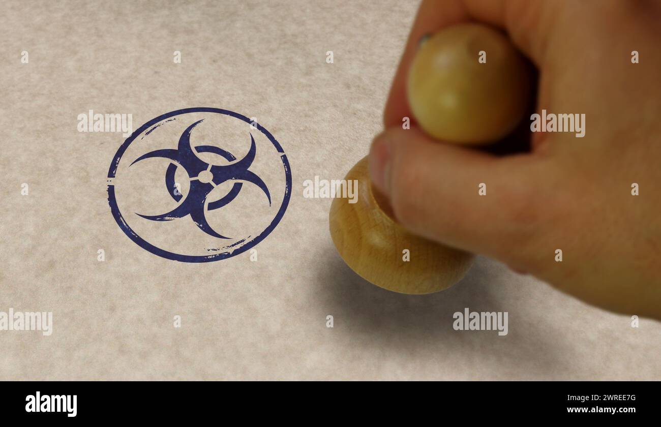 Biohazard warning stamp and stamping hand. Biological hazard symbol concept. Stock Photo