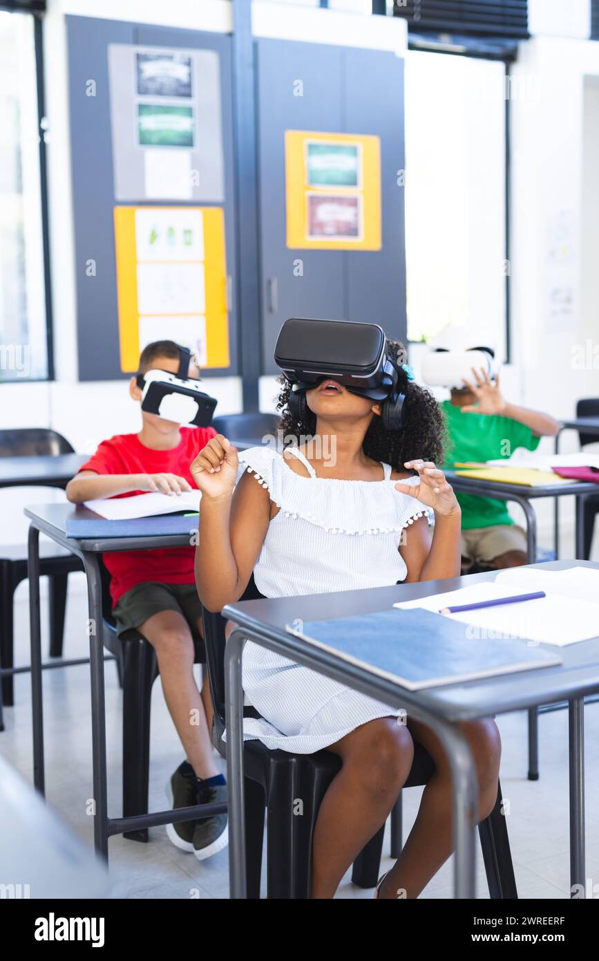 Biracial children are engaged with virtual reality headsets in a
