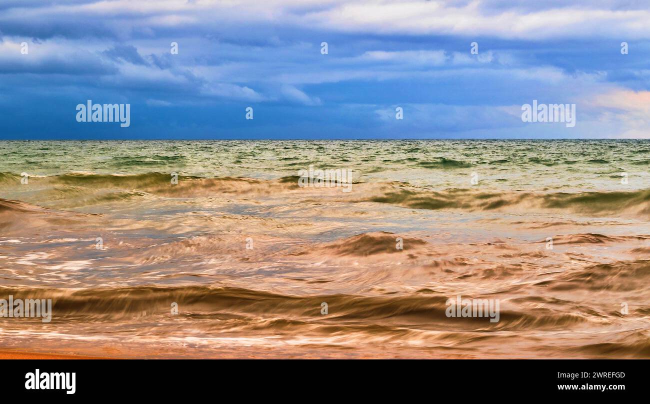 Sea after storm, when sun shines. Three color of view. Indian ocean, Sri Lanka. Stock Photo