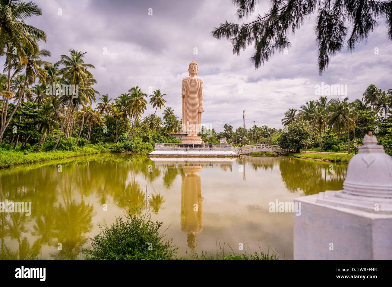 Peralyia Buddha statue on place, where were in 2004 killed thousands of people in tsunami disaster. It is replica of famous Bamian Buddha statue in Af Stock Photo