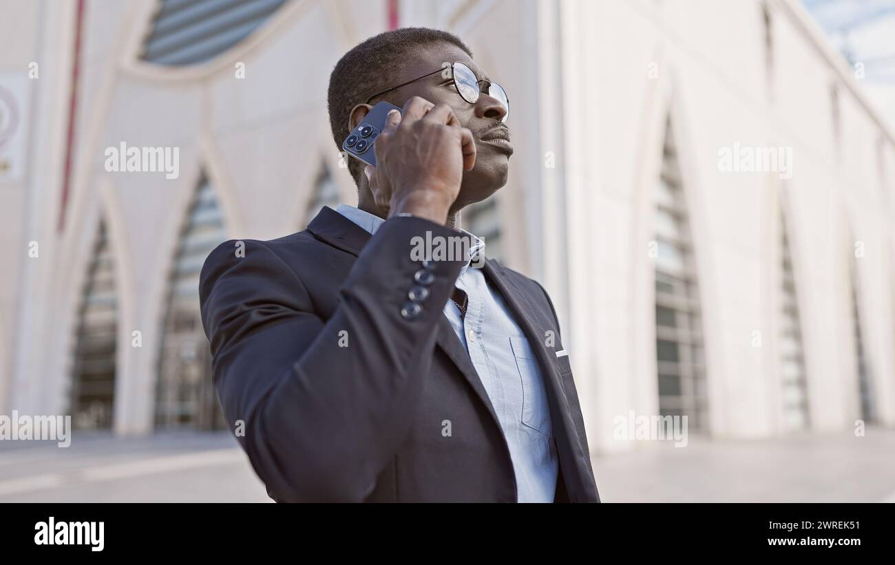 Stylish businessman in suit on sunny city street hi-res stock ...