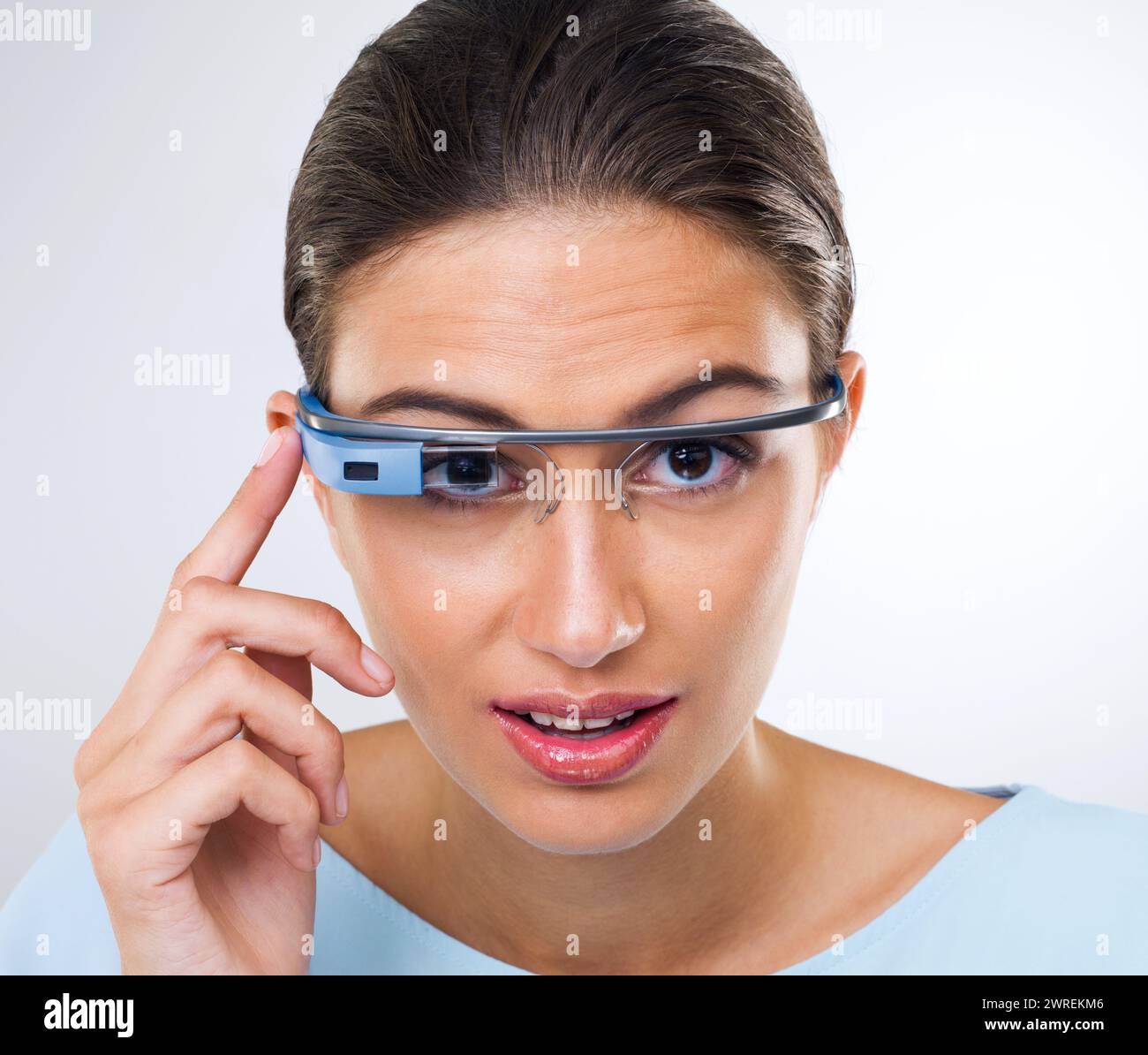 Portrait, woman or smart glasses for augmented reality, metaverse or serious in studio isolated on white background. Face, cyber eyewear or future Stock Photo