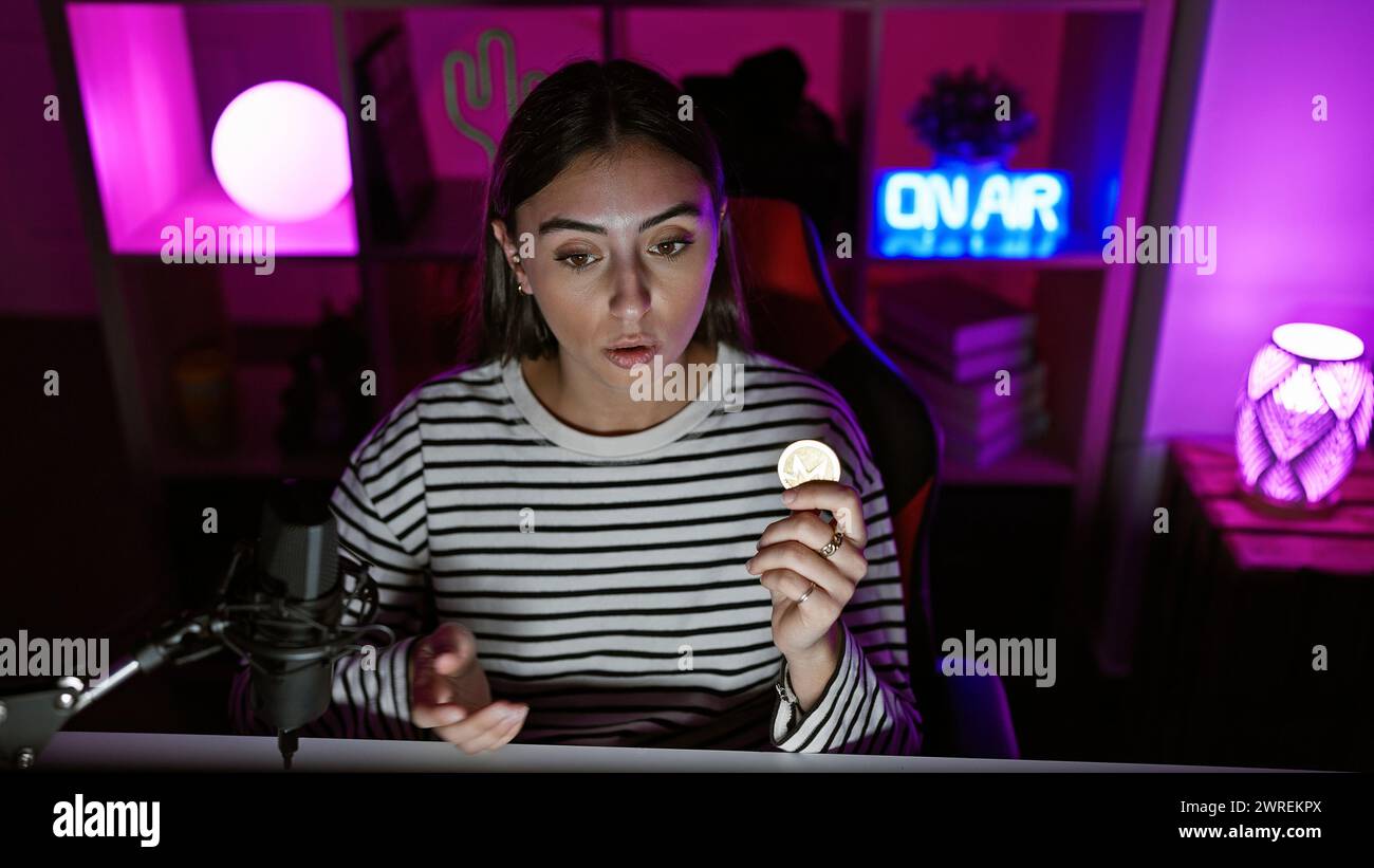 Young hispanic woman holds bitcoin hi-res stock photography and images -  Alamy