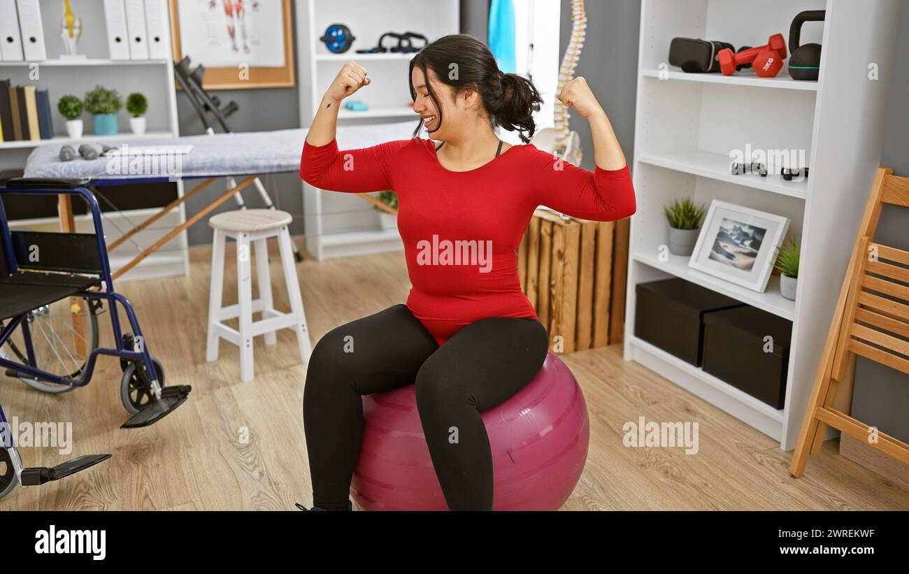 A smiling young hispanic woman celebrates her progress by making a