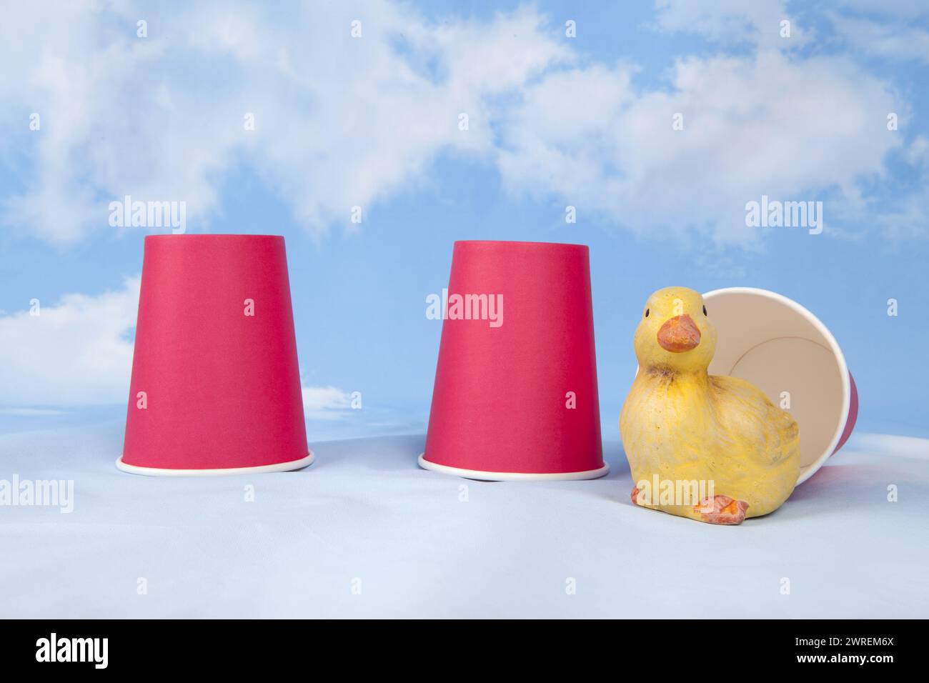 Three paper cups are used to play the game of bonneteau. Under one of ...