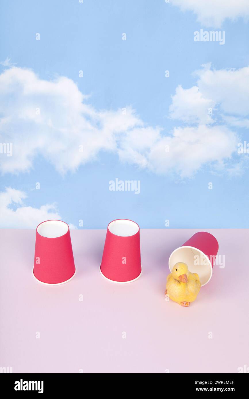 Three paper cups are used to play the game of bonneteau. Under one of ...