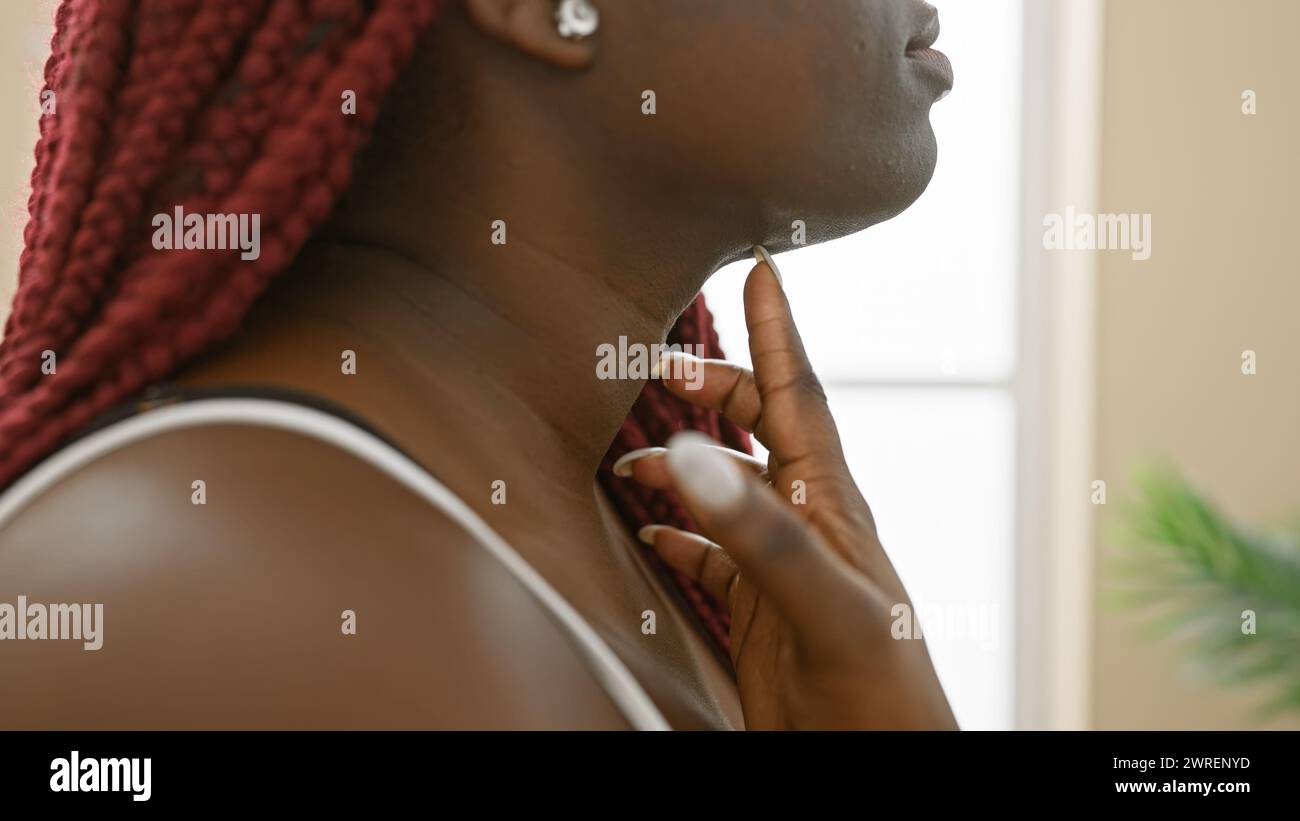 African american woman with red braids in a peaceful home environment ...