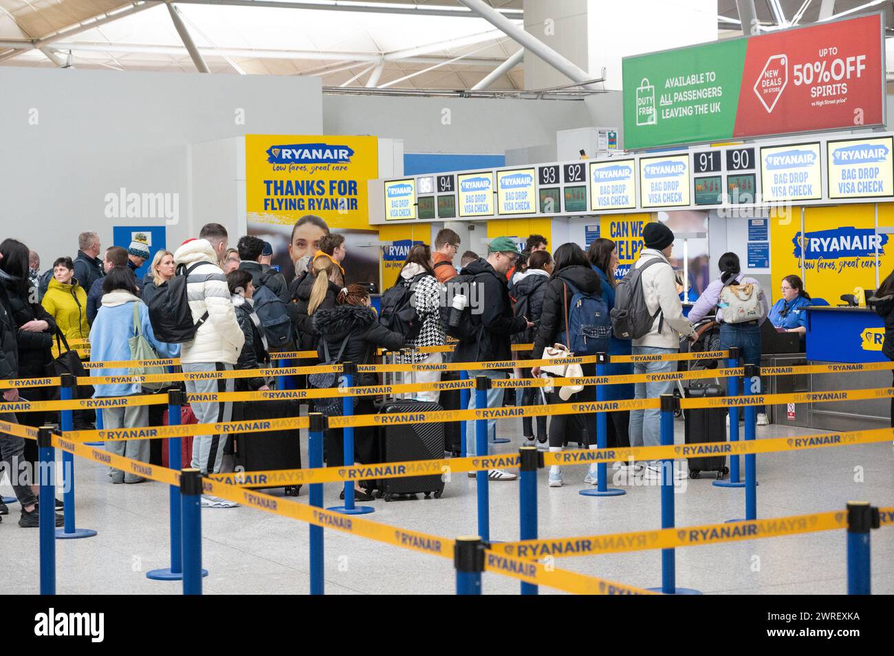 Checking in at Ryanair desks in London Stansted airport Stock Photo