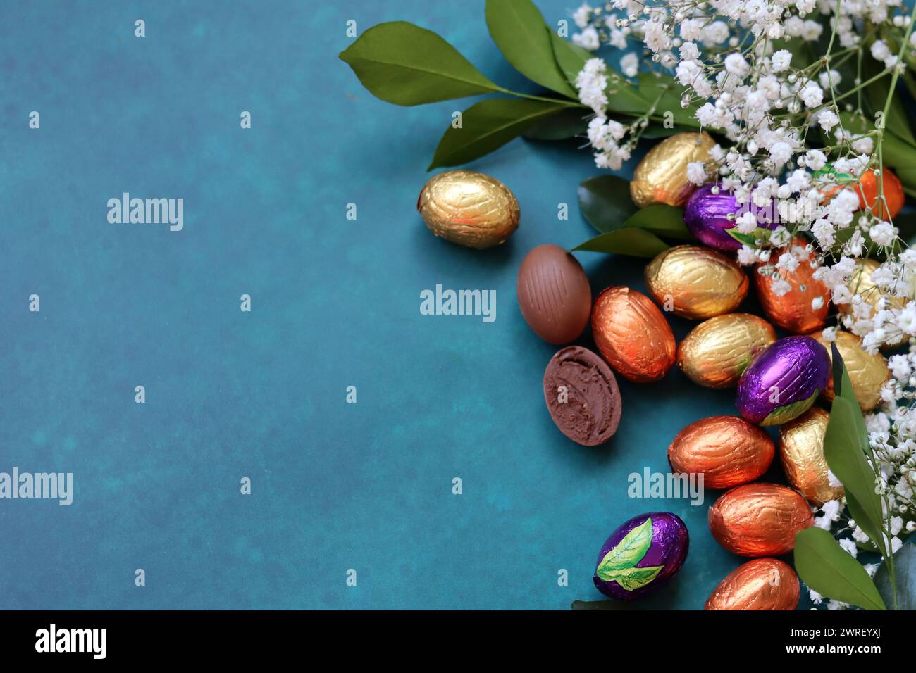 Easter greeting card. Colorful still life with eggs and flowers. Stock Photo