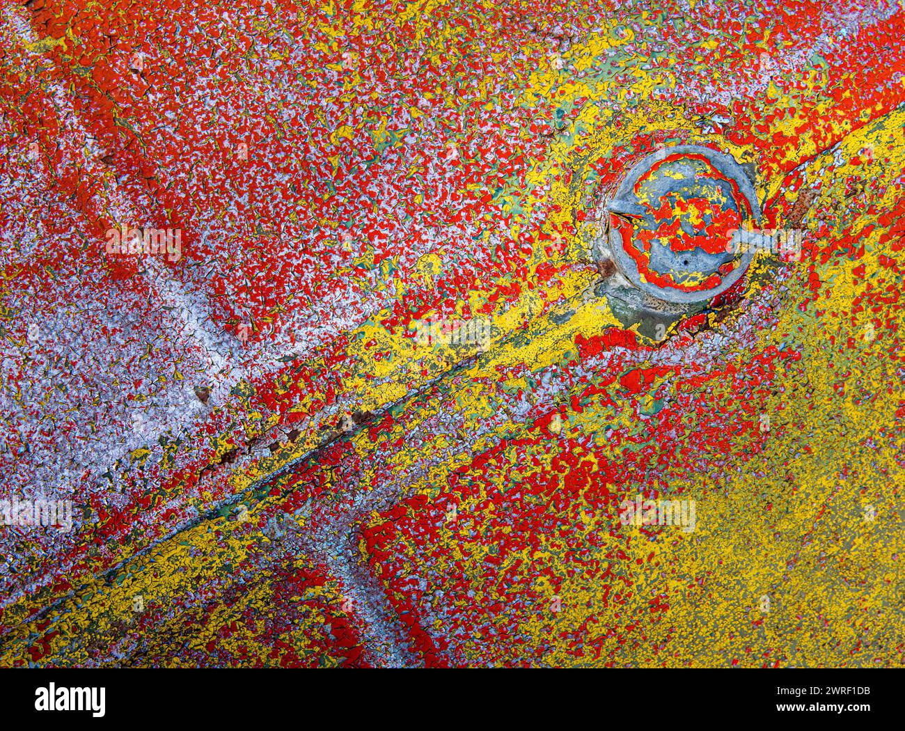 Chipped and peeling paint on the hood of old tractor in the "Truck