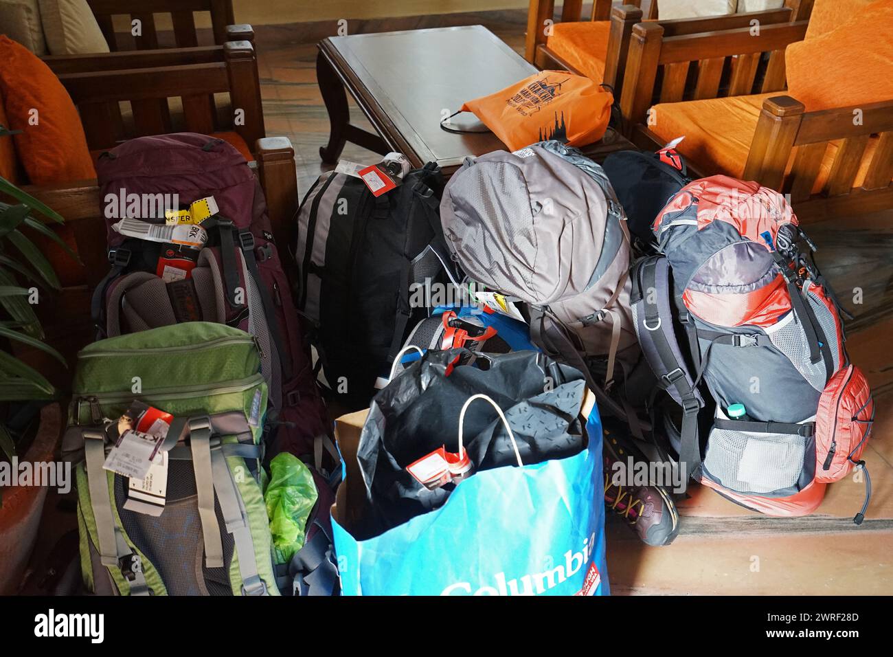 Stack of colorful backpacks and stuff on the ground- Pokhara, Nepal Stock Photo