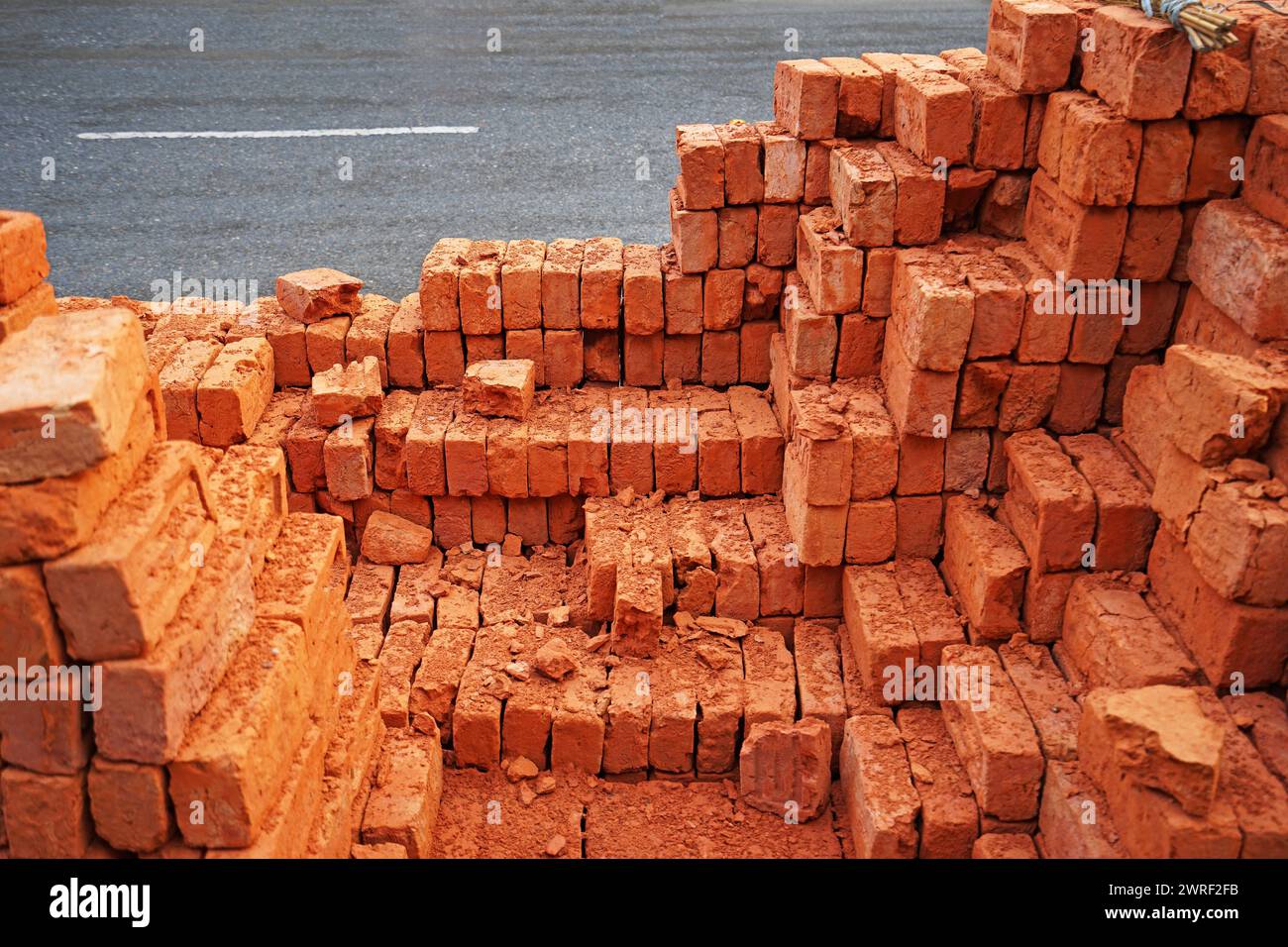 Stacks of natural red clay brick Stock Photo