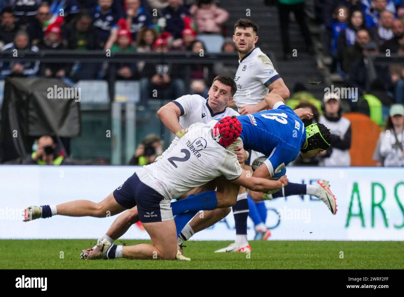 Juan Ignacio Brex of Italy is tackled by George Turner of Scotland during the Guinness Six Nations 2024 rugby union international match between Italy and Scotland at the Olympic Stadium. Final score: Italy 31 - 29 Scotland. Stock Photo