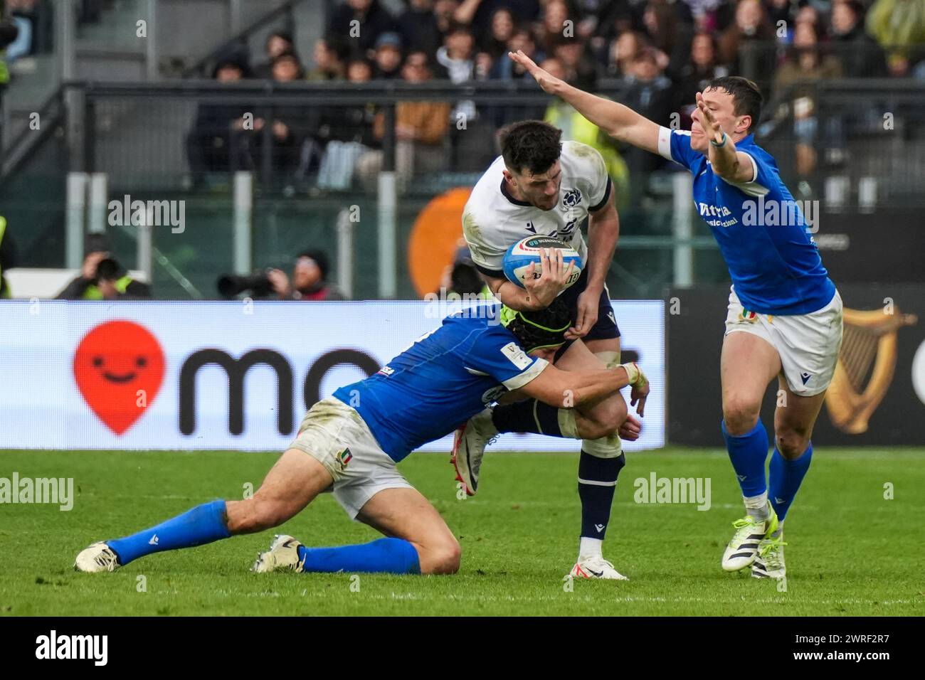 Blair Kinghorn of Scotland is tackled by Juan Ignacio Brex of Italy during the Guinness Six Nations 2024 rugby union international match between Italy and Scotland at the Olympic Stadium. Final score: Italy 31 - 29 Scotland. Stock Photo