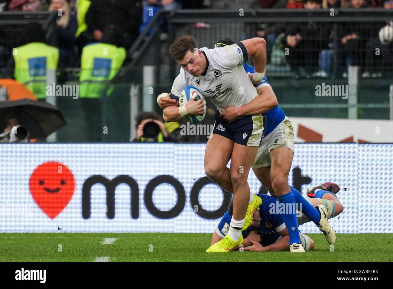 Huw Jones of Scotland is tackled by Juan Ignacio Brex of Italy during the Guinness Six Nations 2024 rugby union international match between Italy and Scotland at the Olympic Stadium. Final score: Italy 31 - 29 Scotland. Stock Photo